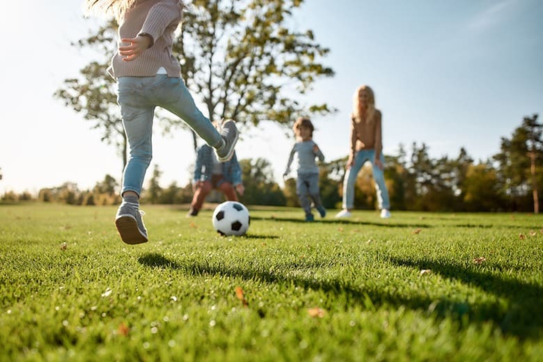 kids playing soccer outside