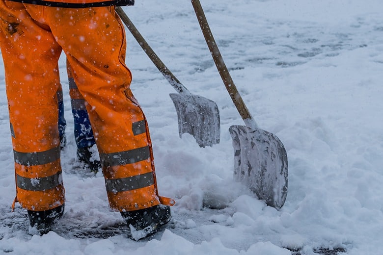 worker-shoveling-snow-cold-weather