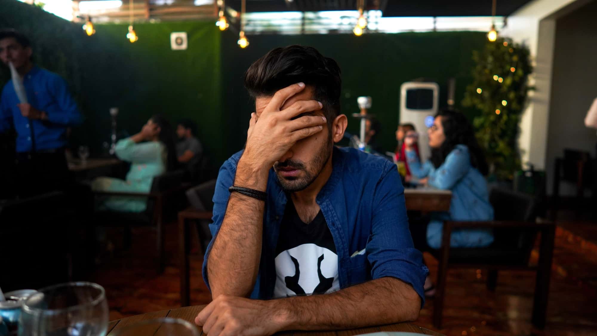 Upset Man with hand on his face