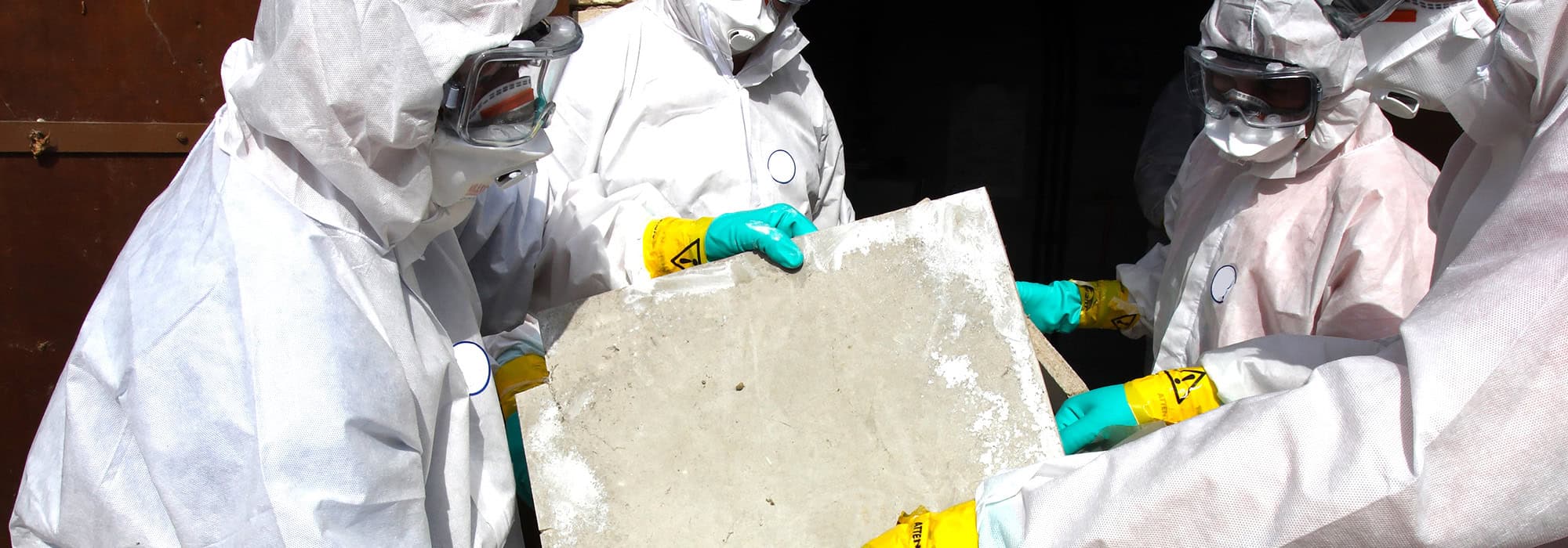 asbestos-remediation-removing-material asbestos remediation crew removing dangerous material