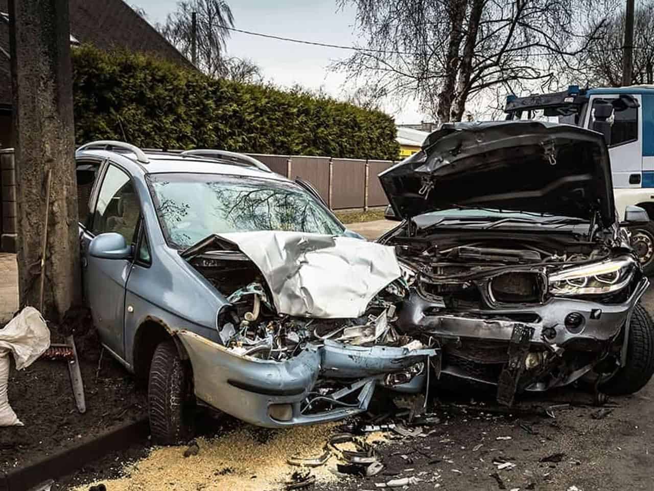 Car accident scene with two cars and telephone pole