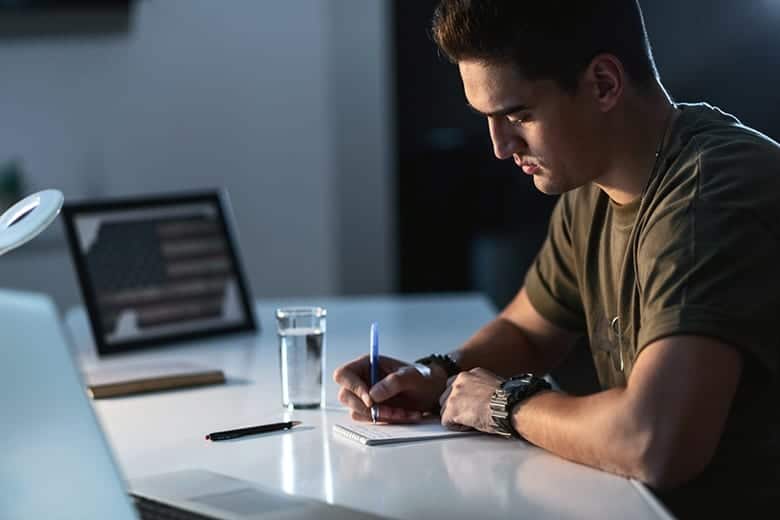 solider writing on paper pad
