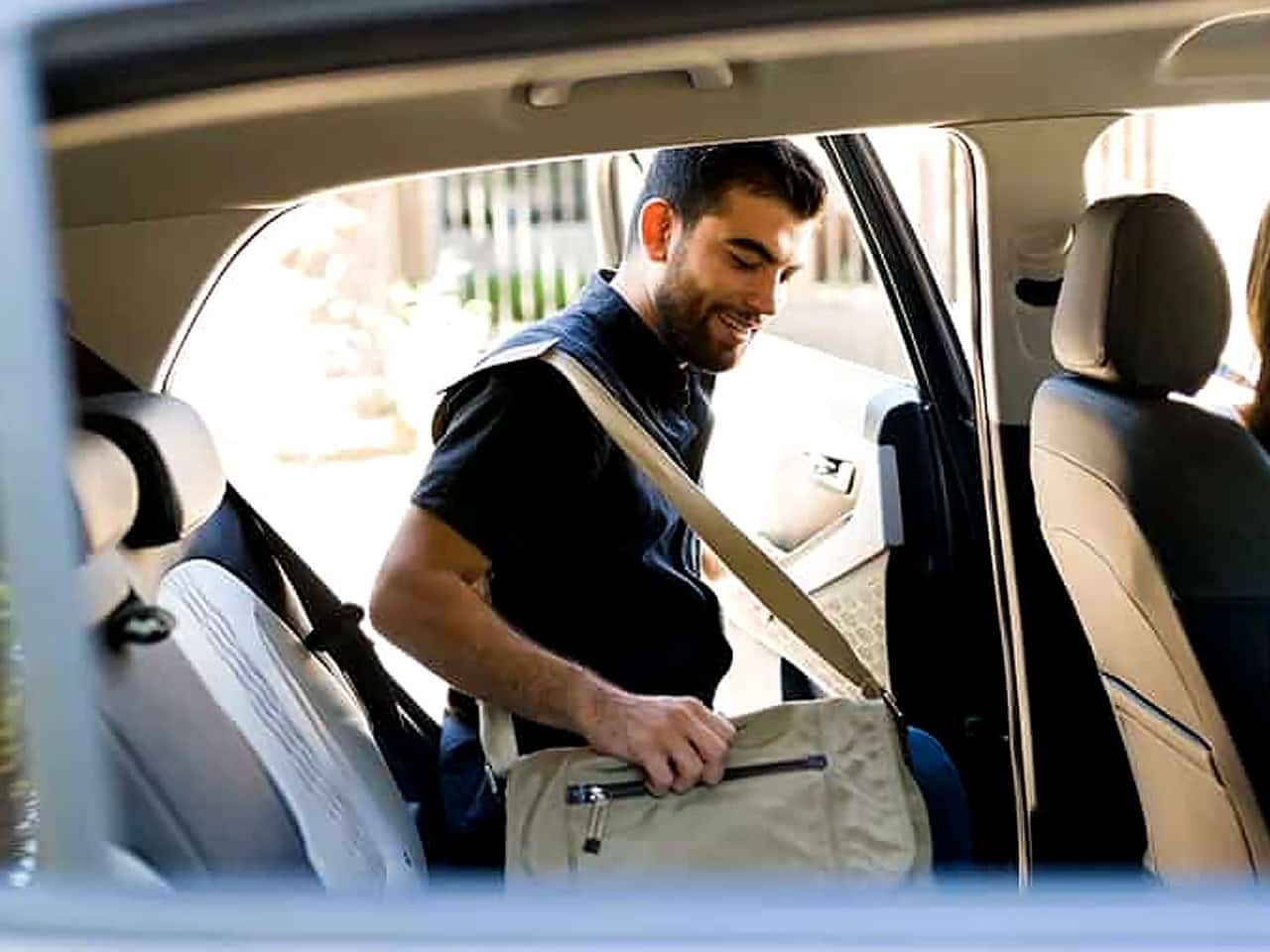 Man getting into an uber vehicle