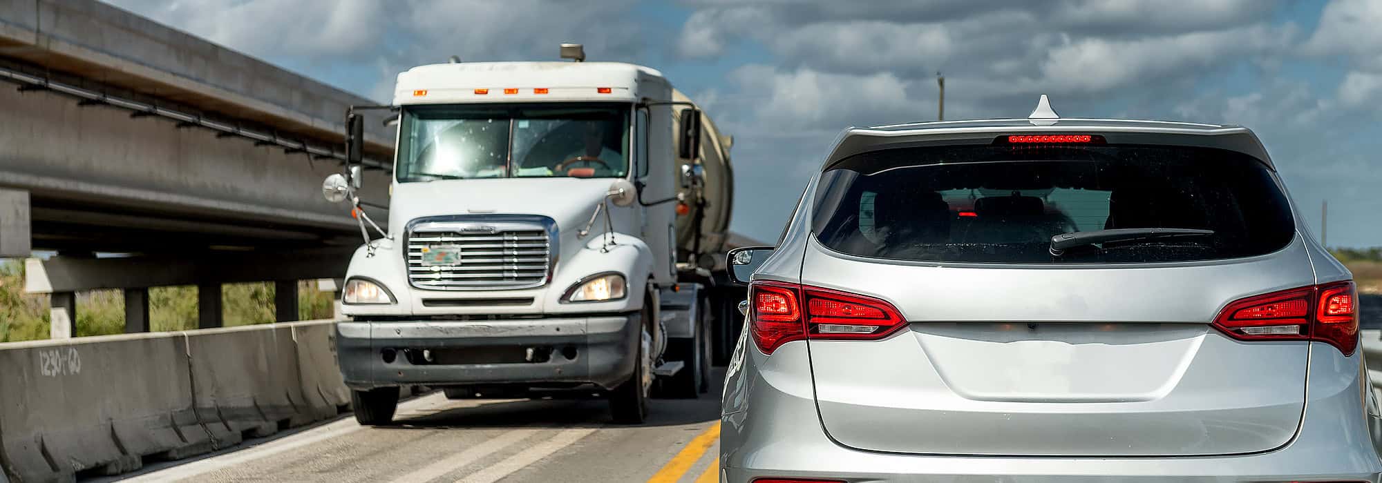 Truck passing suv on highway