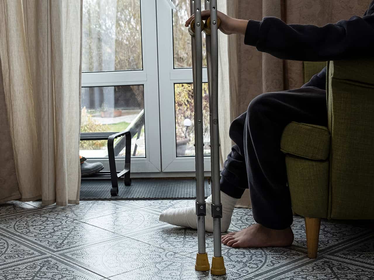 Young man with broken foot