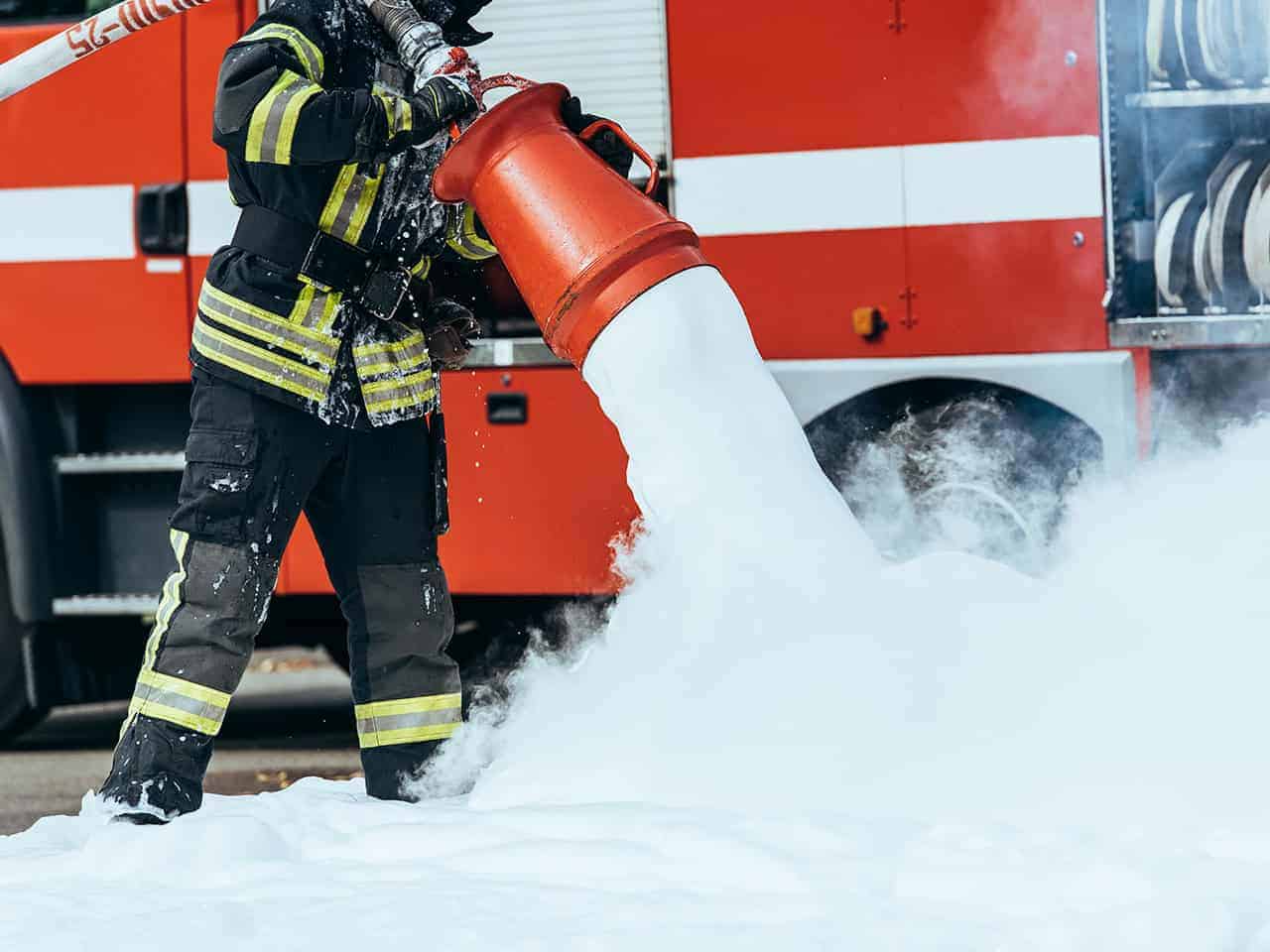 Firefighter using foam
