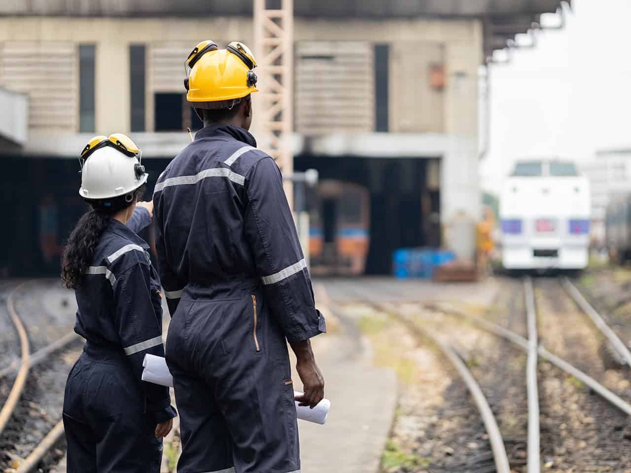 Two railway workers on site