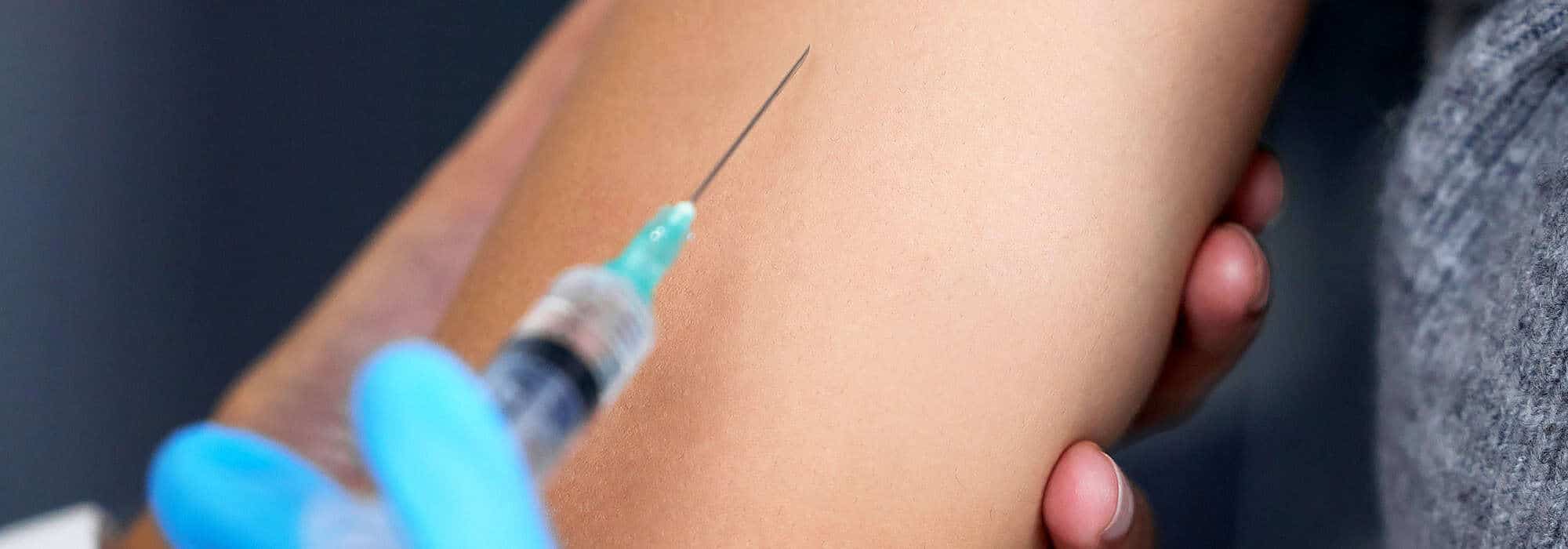Woman receiving an injection