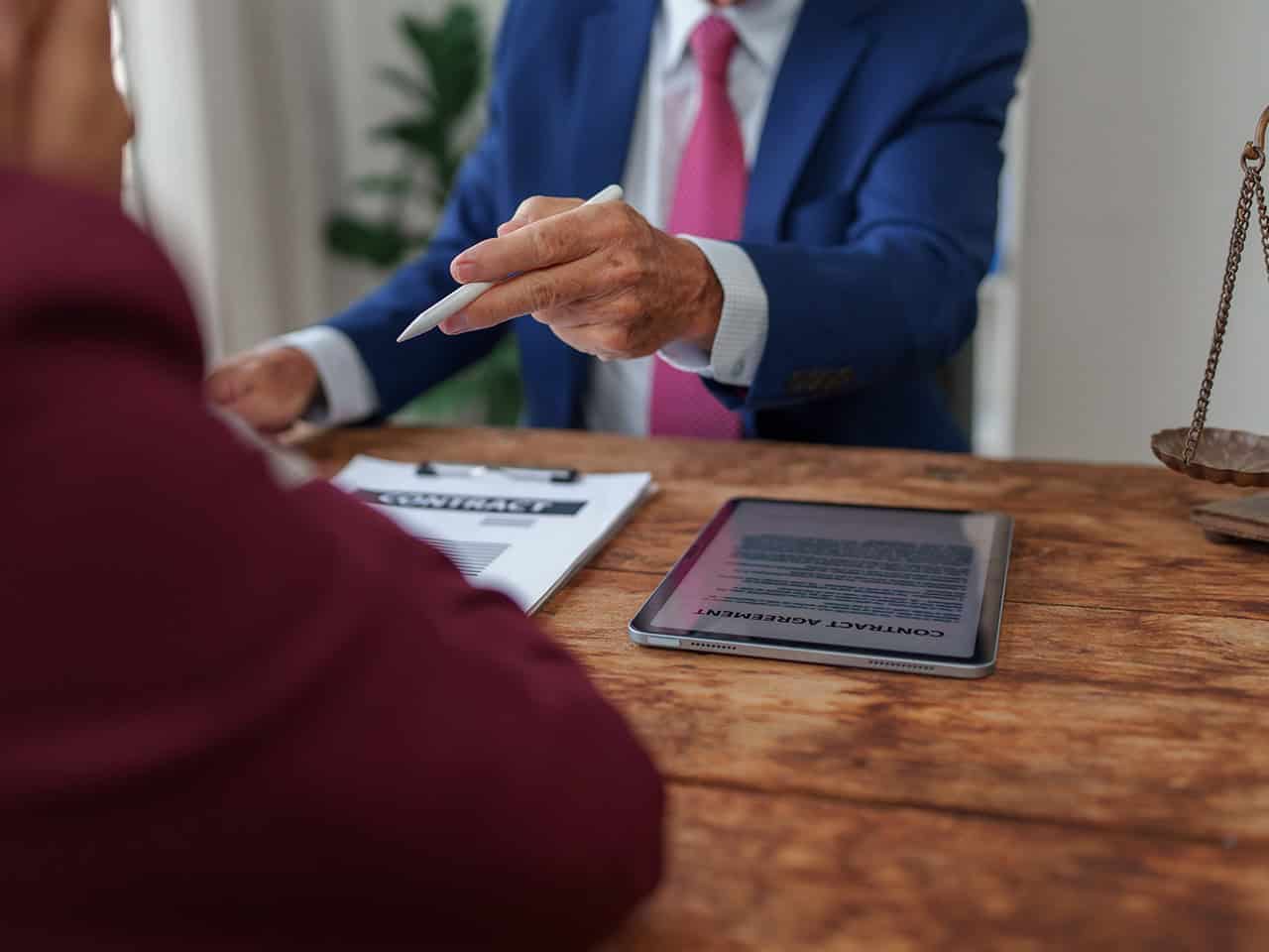 Attorney and client discussing a contract