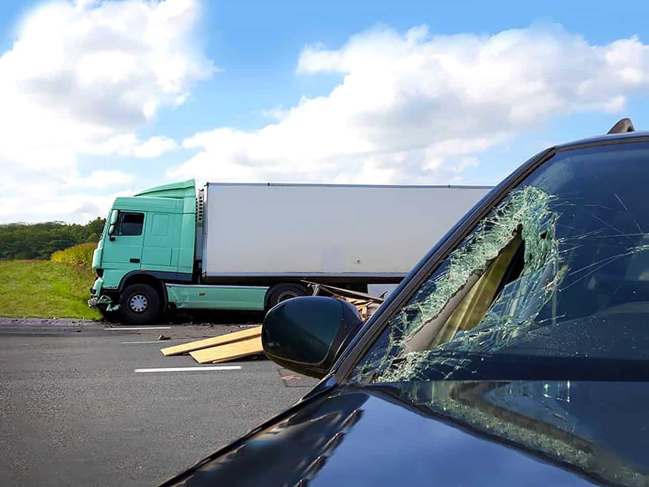 Damaged car after truck accident