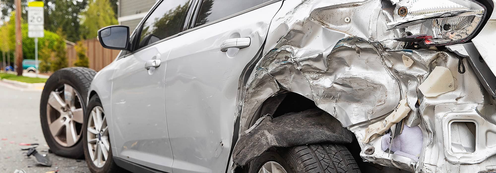 Grey sedan damaged after crash