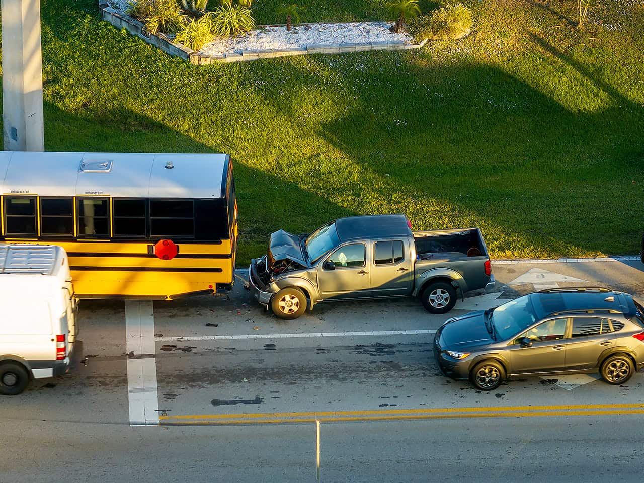 Truck rear ends school bus