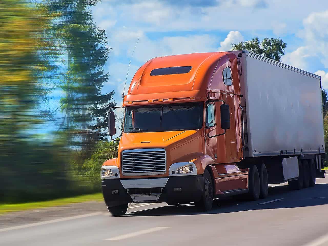 Truck speeding down busy road