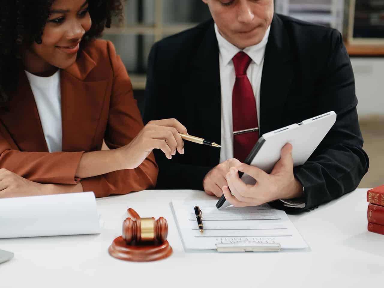 Attorneys reviewing client paperwork
